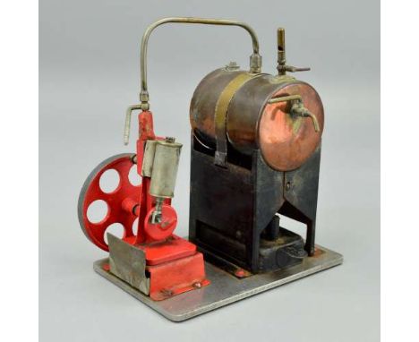 AN UNMARKED SINGLE CYLINDER LIVE STEAM ENGINE, not tested, copper boiler on black base complete with burner, driving red pain