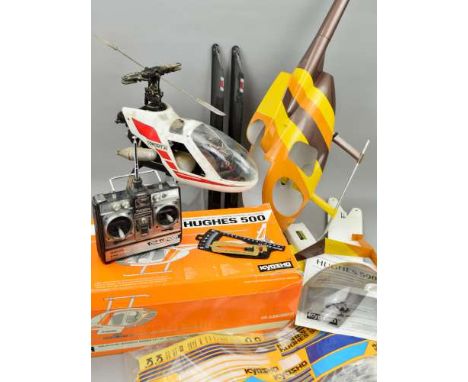 A KYOSHO CONCEPT 30 HUGHES 500 HELICOPTER BODY KIT, size 28-32, part assembled but contents not checked, no motor, but has in