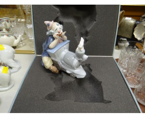 A boxed Lladro Privilege series clown on a train figure