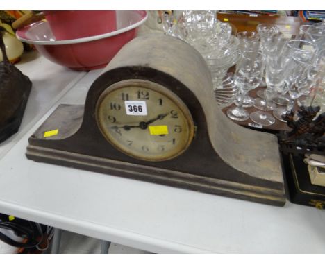 A dome top mantel clock