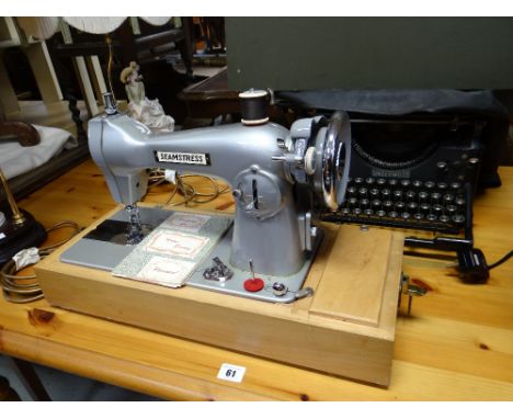 A vintage cased seamstress sewing machine