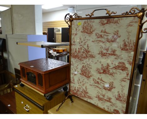 A reproduction music system with turntable in the form of a vintage radio together with a small stand & a copper effect fire 