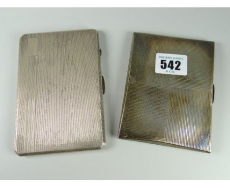 A pair of engine turned silver cigarette cases