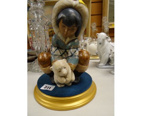 A Lladro figure of an eskimo child on plinth