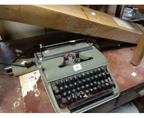 Vintage Olympia typewriter, vintage camp bed & projector screen