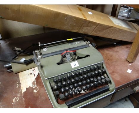 Vintage Olympia typewriter, vintage camp bed & projector screen