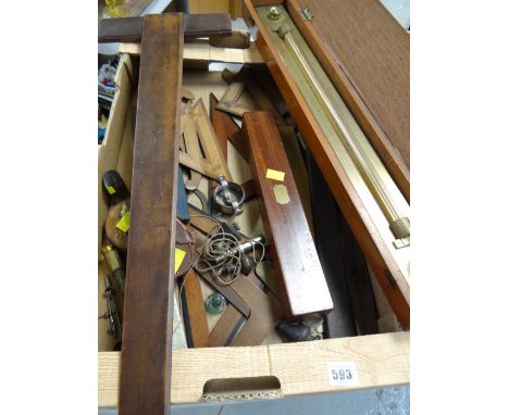 Collection of various vintage technical drawing equipment including rulers, set squares, tape measures etc