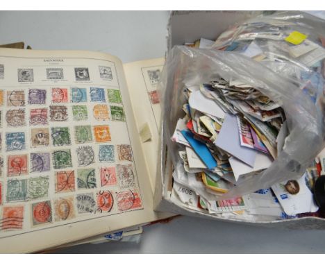 A vintage stamp album & parcel of loose stamps