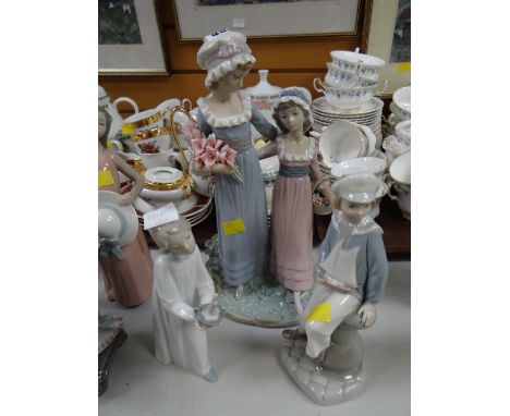 Two Lladro figures together with a Nao figure of a girl with candlestick