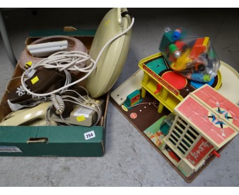 A child's plastic garage set together with several telephones & a glass light shade