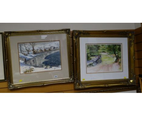 A watercolour of a lake in winter with swans together with another modern framed print