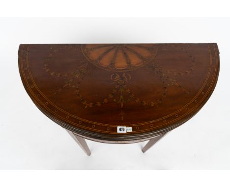 A GEORGE III MARQUETRY INLAID DEMI-LUNE FOLD OVER CARD TABLE90cm wide; 44cm deep; 74cm highCondition report:&nbsp;The marquet