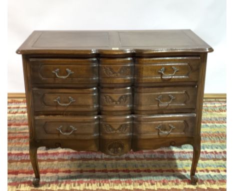 A MODERN FRENCH OAK COMMODE CHESTWith three long drawers 99cm wide; 83cm high
