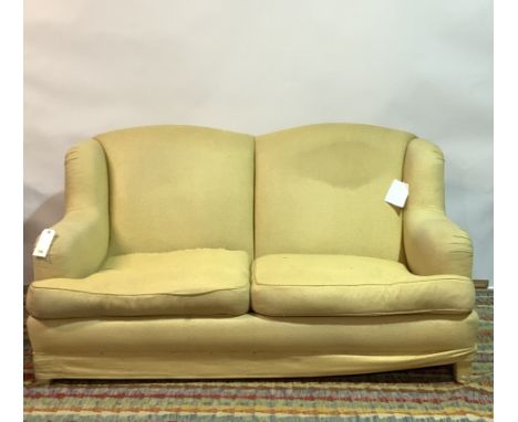 KINGCOMBE, A MODERN HARDWOOD FRAMED TWO SEATER SOFA175cm wide; 95cm highSolid frame however the are rips and marks to the uph