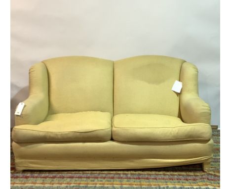 KINGCOMBE, A MODERN HARDWOOD FRAMED TWO SEATER SOFA175cm wide; 95cm highSolid frame however the are rips and marks to the uph