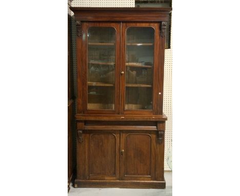 A LATE VICTORIAN MAHOGANY DISPLAY CABINETWith arch moulded doors 104cm wide; 200cm high