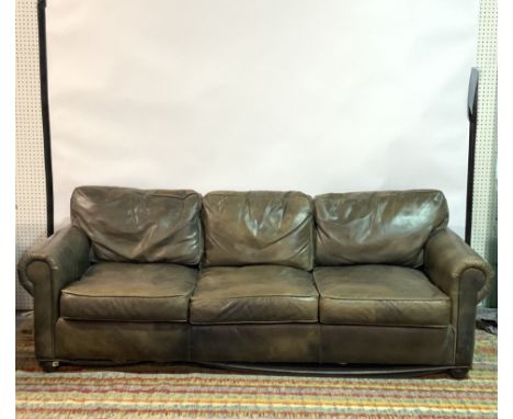 A MODERN HARDWOOD FRAMED THREE SEAT SOFAWith faux leather upholstery 240cm wide; 78cm high