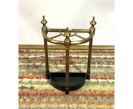 A MODERN BRASS DEMI-LUNE STICK STAND (2)42cm wide; 57cm high, together with an Oka black and gold oval wall mirror , 88cm wid