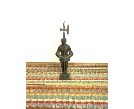 A MODERN CAST IRON FIRE TOOL STANDFormed as a knight, 88cm highMissing one screw to the arm, tools comprising a brush, tongs 