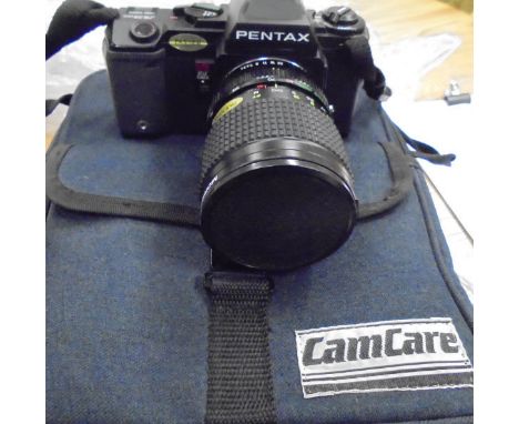 A Pentax 35mm A3 Date camera and accessories in case, together with a Yashica TL Electro 35mm camera with various accessories