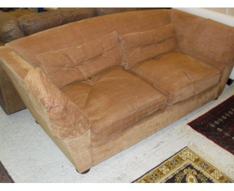 A terracotta ground three seater sofa