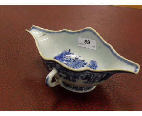 A 19th Century Chinese blue and white double ended sauceboat, together with a Crown Ducal "Florentine" part tea service, Engl