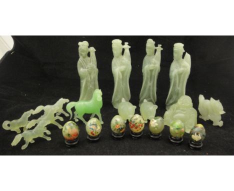 A box containing assorted modern carved jade deity figures, various animals and eggs with painted decoration, together with v