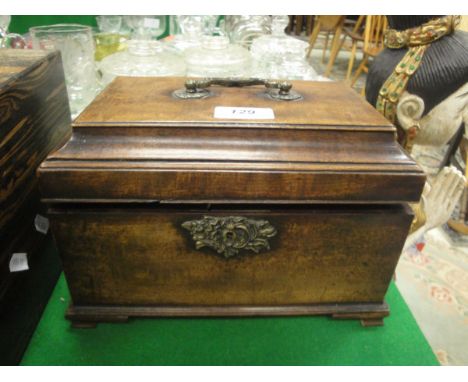 A George III mahogany tea caddy fitted with three lidded compartments raised on ogee bracket feet
