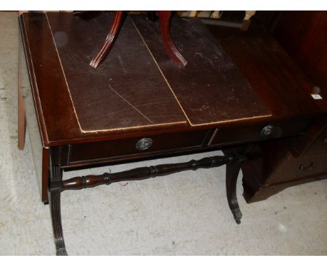 A modern mahogany drop-leaf sofa table in the Regency style bearing label inscribed "Manufactured by N Norman Ltd 43-53 Markf