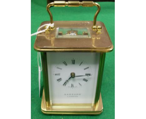 A modern brass cased carriage clock, the movement by Matthew Norman of Switzerland, No'd. 1754, the white enamel dial with Ro