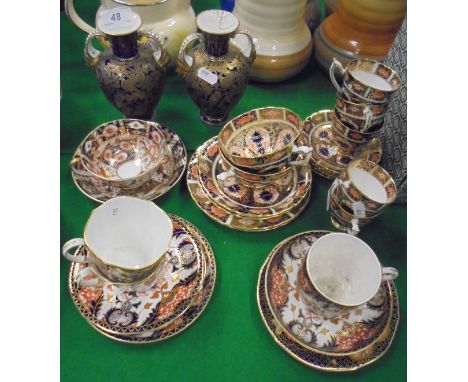 A collection of various Royal Crown Derby including a pair of blue ground gilt foliate decorated vases with mask head decorat