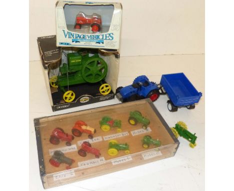 E.R.T.L vintage gasoline engines, John Deere model&nbsp;"E" engine, eight small die-cast tractors in plastic show case and on