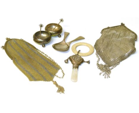 Two evening bags, two open silver salts, two silver caddy spoons and a baby rattle. Condition reports are not available for t