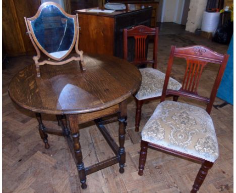 Early 20th century oak gate-leg table, 92cm diameter, pair of Edwardian dining chairs and shield back swing frame mirror. Con