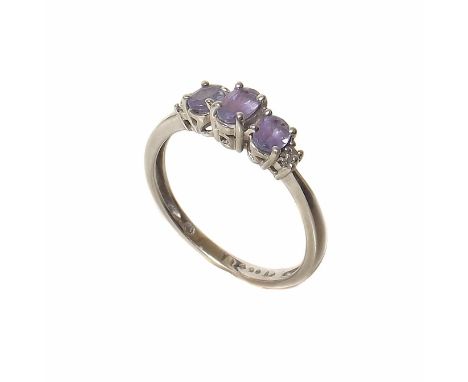 A tanzanite 3-stone platinum ring Condition reports are not available for the Interiors Sale.