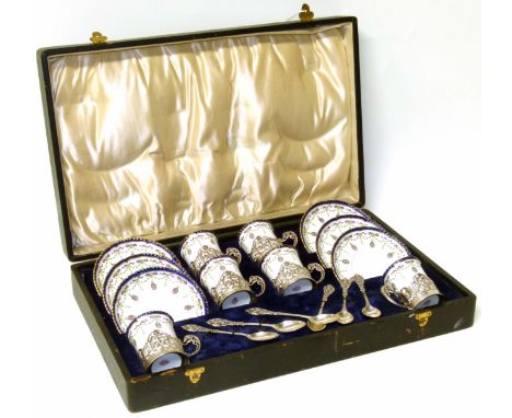 Royal Worcester silver and porcelain tea set, comprising six cups and saucers and six silver teaspoons, complete in fitted bo