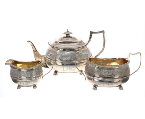 George III matched silver three piece tea set, comprising tea pot, 6.5" high, twin-handled sucrier and cream jug, with engrav