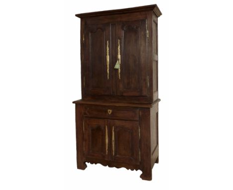Early 19th century French Normandy oak cupboard, the raised cupboard with panelled double doors applied with attractive brass