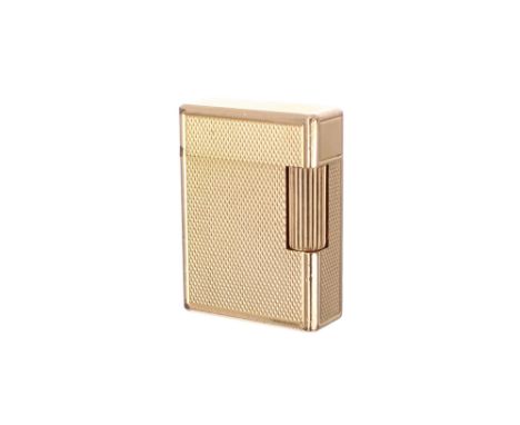 Dupont engine turned gold plated lighter, within an engine turned case inscribed 'Dupont, Paris, Made in France' to the base,