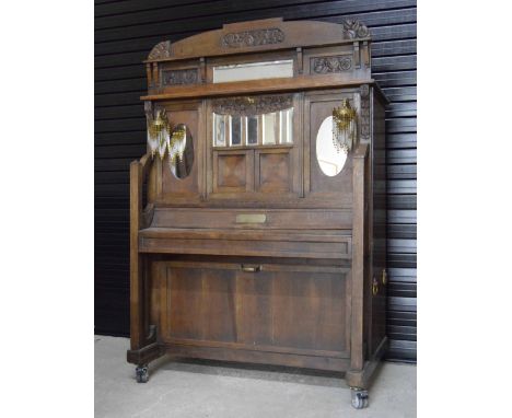 Interesting and rare oak cased barrel piano, bearing the makers' plaques to the front and side inscribed Fabrique de Pianos, 