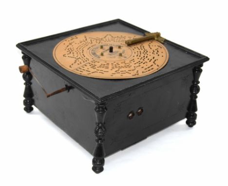 Christon manual table symphonium, with patent brass moulding within an ebonised square case raised on turned legs, 9" high, 1