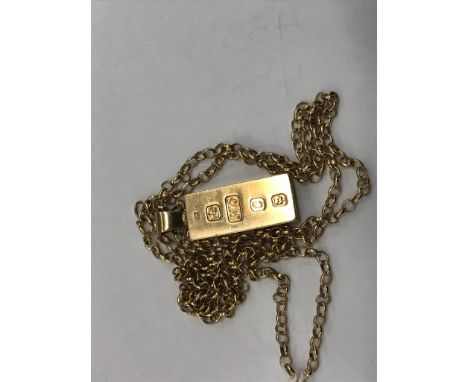 A 9ct ingot pendant on a chain