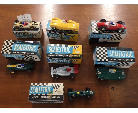 Seven boxed Scalextric cars: Green D type Jaguar, C60 D type Jaguar, C67 F J Lotus, C66 Cooper, C62 Lotus with rear engine, F