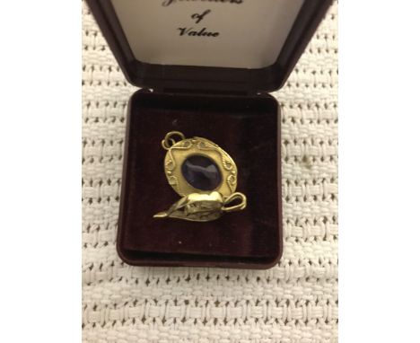 A 9ct amethyst set locket and pendant