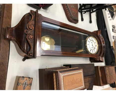 An Edwardian mahogany Vienna wall clock