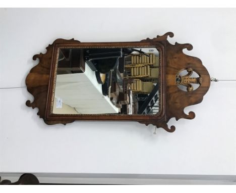 A Georgian-style walnut mirror