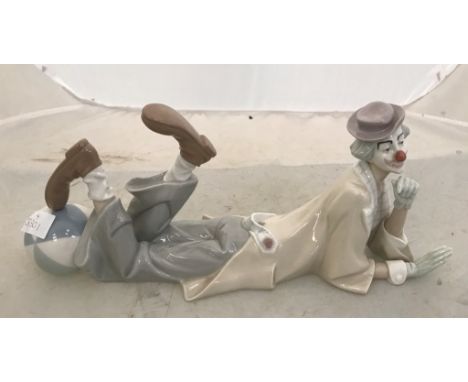 A Lladro figure of a reclining clown