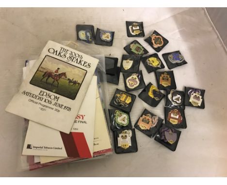 A quantity of enamel racing badges; together with a quantity of racecards