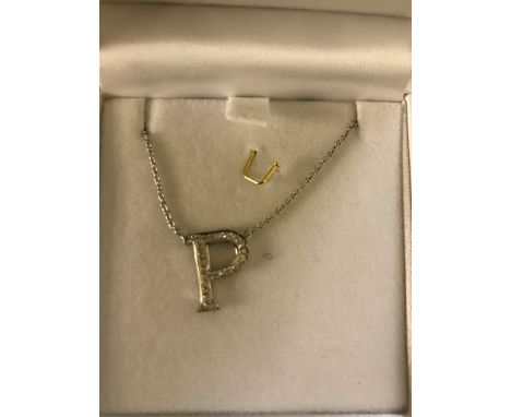 An 18ct  diamond set "P" on chain