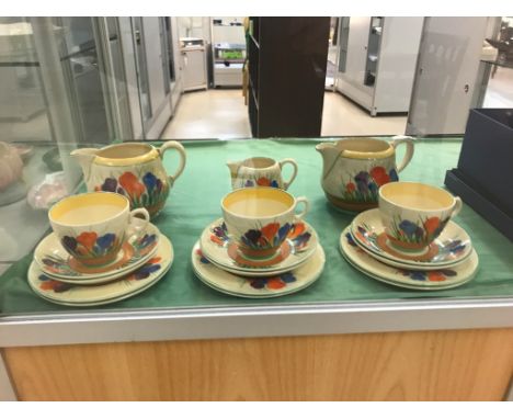 A Clarice Cliff 'Crocus' pattern part tea-service by Wilkinson Ltd - gold print to base